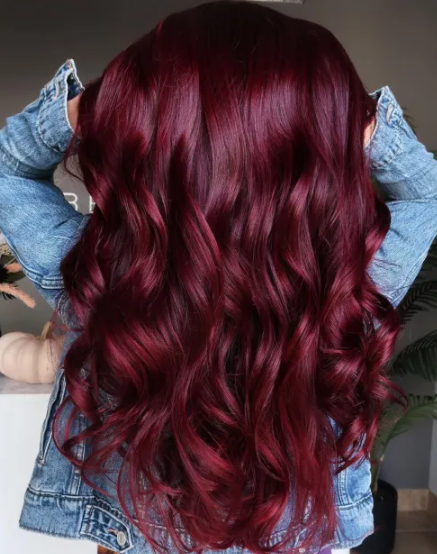 Dark Red Hair Voluminous Curls Style