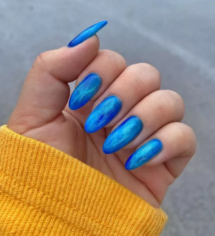 Shimmery Blue Cat Eye Nails